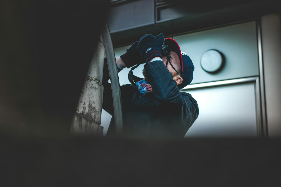 Turkish camera operator filming on a television studio floor