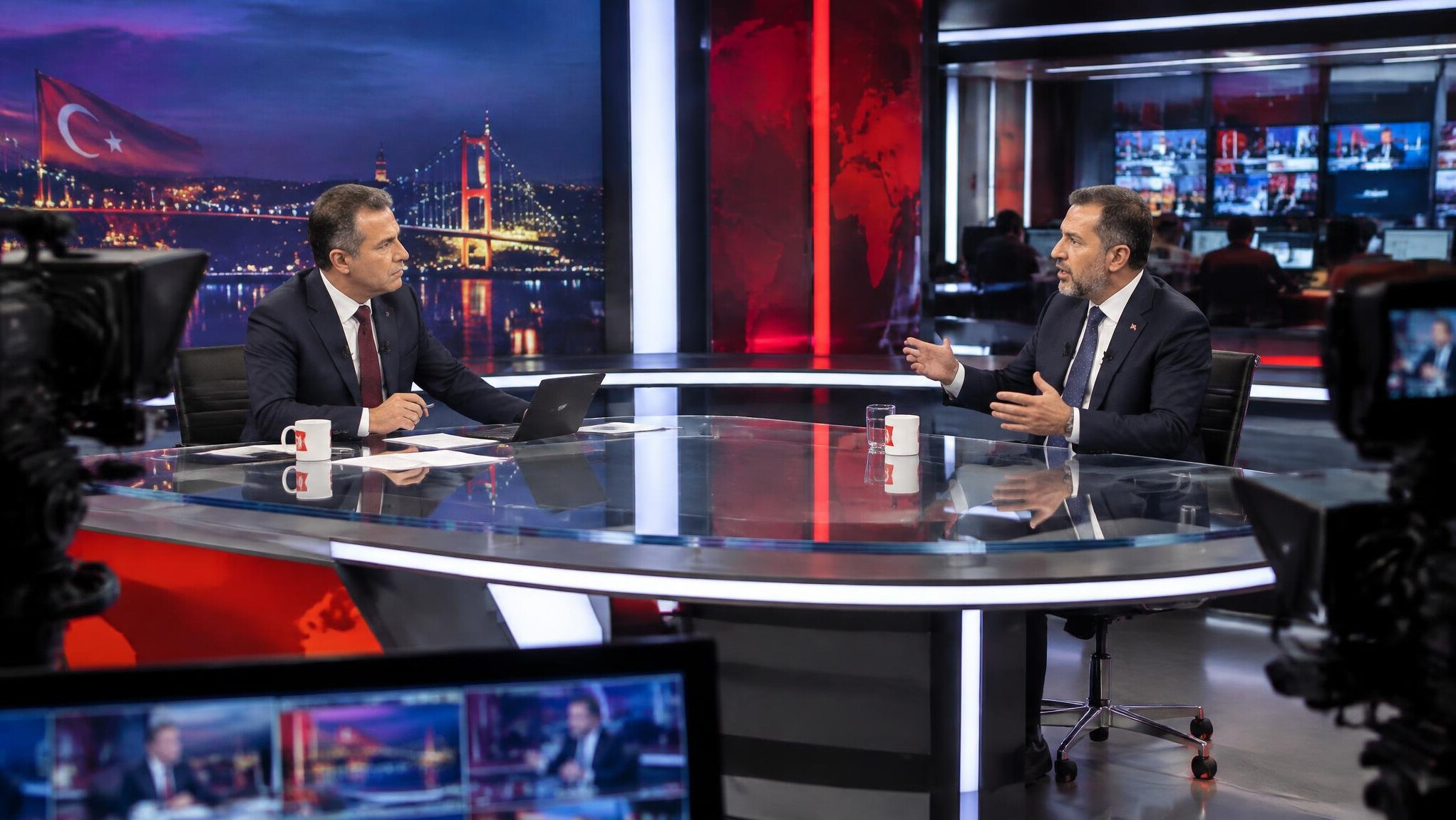 Tense moment between a news anchor and a guest during a live Turkish television broadcast